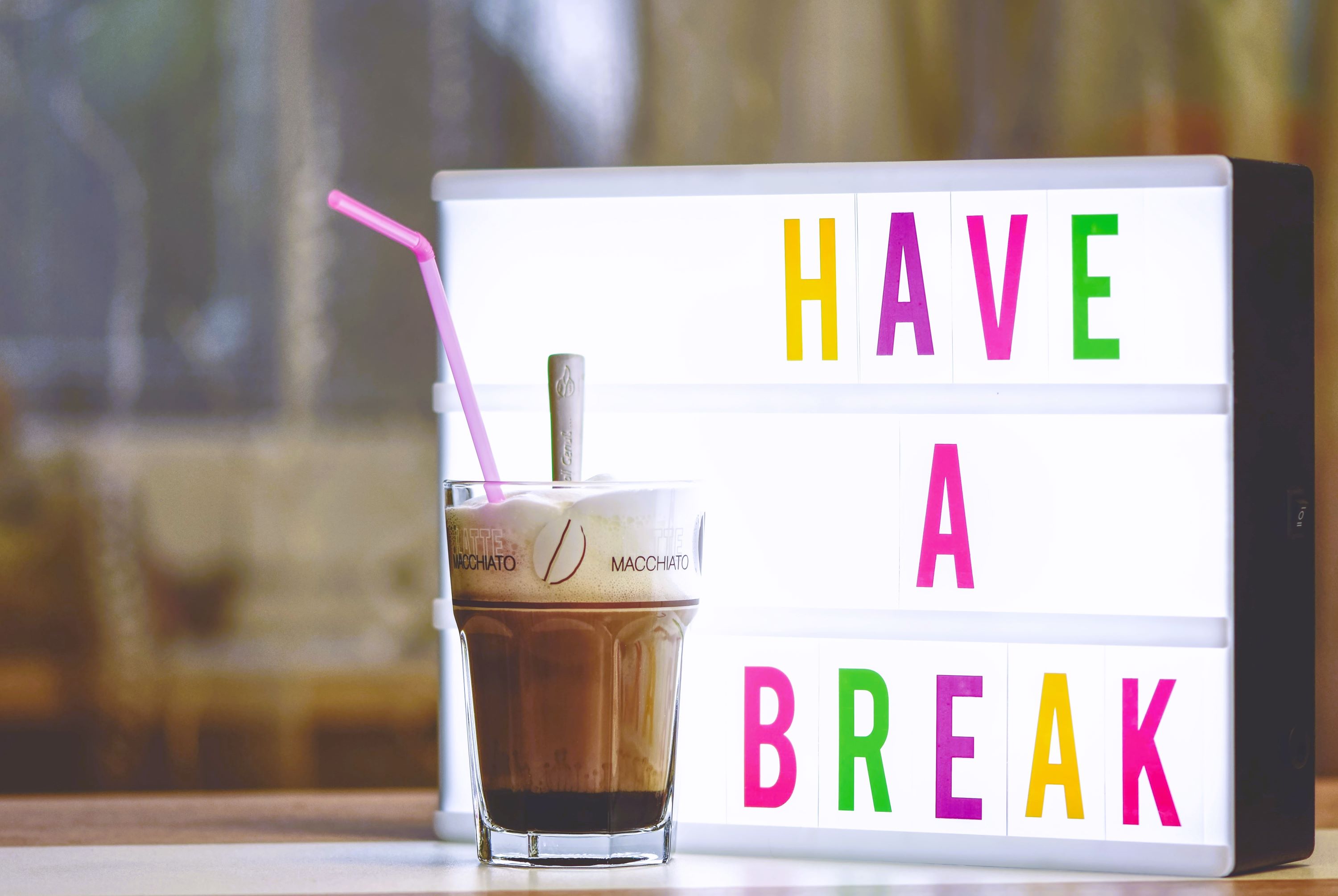 Cup of iced-coffee with Have a Break sign